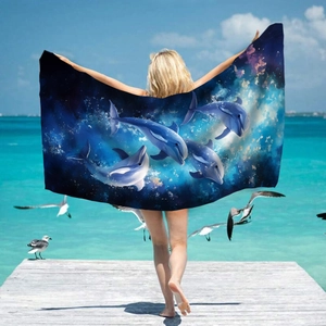Microfiber beach towel featuring dolphin jumping with starry ocean and deep blue sky scenery