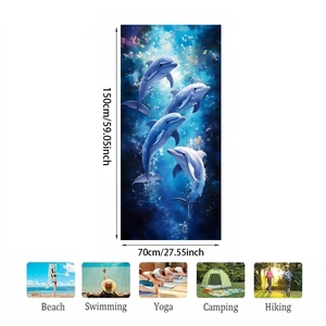 Detail of 150x70cm microfiber beach towel featuring blue dolphin print and usage icons