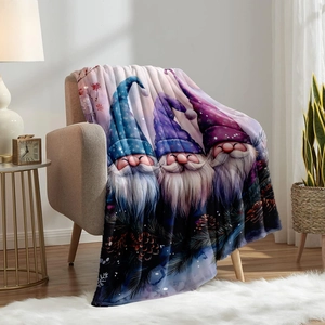 Digital print flannel blanket featuring three Christmas gnomes on a cozy sofa setting