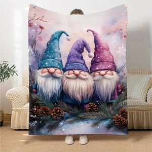 Close-up of flannel blanket showing three holiday gnomes in a winter forest scene