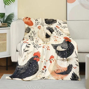 Detailed close-up of soft flannel blanket featuring rooster prints on a sofa