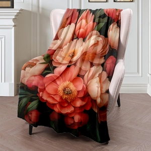 Peony floral print flannel blanket draped on a chair in a cozy home setting