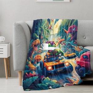 Flannel dinosaur blanket with colorful cartoon jungle adventure print on grey sofa