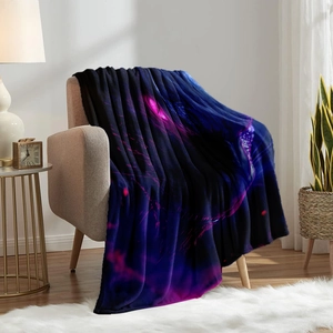 Flannel blanket with glowing eyes print draped over a chair for cozy home decor