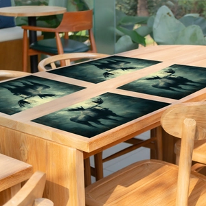 Set of 4 forest moose pattern placemats on a wooden table for rustic dining decor