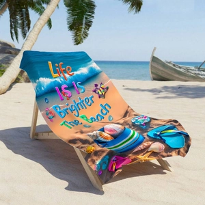 Microfiber beach towel with sea shells print and Life is Brighter at the Beach text