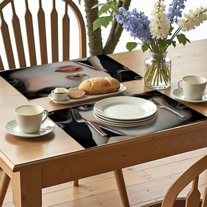 Modern placemats with artistic female face design on a rustic wooden dining table