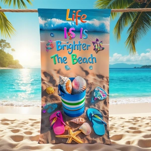 Microfiber beach towel with sea shells print and Life Is Brighter At The Beach text