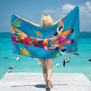 Colorful giraffe microfiber beach towel with tropical floral print in sky blue