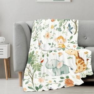 Soft jungle animal pattern flannel blanket on a gray sofa for a cozy home atmosphere
