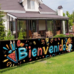 Outdoor welcome banner with colorful Bienvenidos text and school theme graphics
