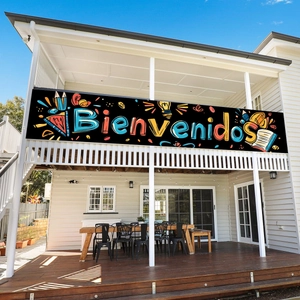Spanish Bienvenidos back to school banner hanging on a modern white balcony balcony