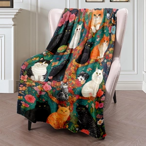 Digital print flannel blanket with cat and floral patterns on a pink sofa