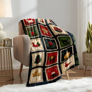 Detailed texture of Christmas flannel blanket with festive stamp patterns on a sofa