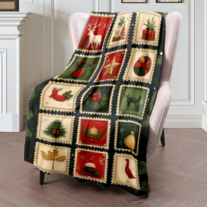 Christmas flannel throw blanket with vintage reindeer and tree stamp print on sofa