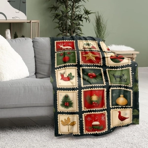 Christmas vintage stamp pattern flannel throw blanket displayed on a gray sofa