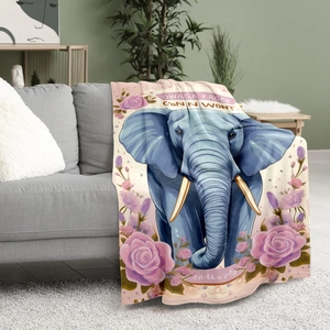 Floral elephant print flannel throw blanket with blue elephants and pink roses on sofa