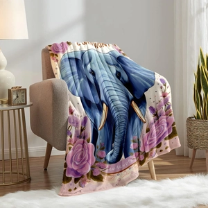 Blue elephant and floral printed flannel blanket draped over a cozy beige armchair