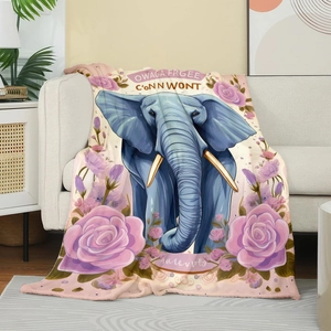 Detailed close-up of soft flannel blanket featuring blue elephant and rose prints on a sofa