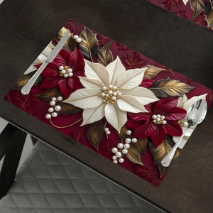 3D floral placemat with red and white poinsettias and pearls on a dark wood table