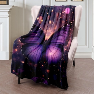 Purple mystical butterfly flannel throw blanket draped over a cozy cream armchair