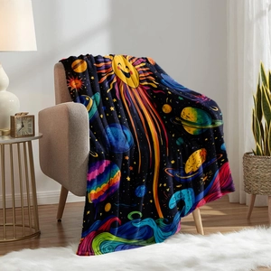 Cartoon space flannel blanket featuring sun and planet patterns on a cozy armchair