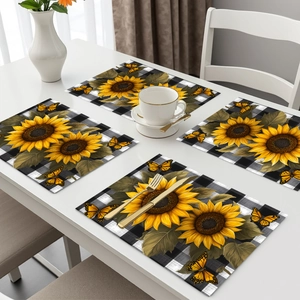 Set of 4 sunflower and buffalo plaid placemats with elegant gold cutlery on table