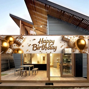 Elegant gold Happy Birthday banner with balloons and gift boxes on luxury terrace