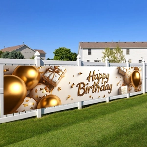 Golden balloon birthday banner hanging on white fence for indoor outdoor party decor