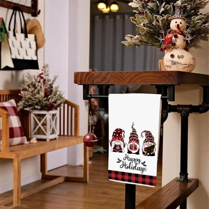 Christmas Gnome hand towel with Happy Holidays text and festive red plaid border design