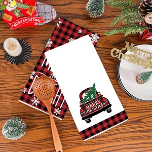 Christmas hand towels with red buffalo plaid truck and snowflake patterns for kitchen decor