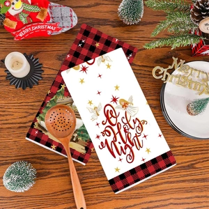 Christmas hand towels with buffalo plaid angel pattern on a cozy wooden background