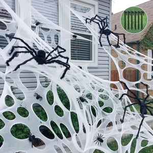 Outdoor Halloween decoration set with large white spider web, black spiders and lawn stakes