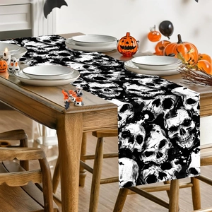 Halloween table runner with black and white skull patterns for festive dining decor