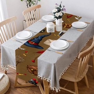 Brown Halloween table runner with magic hat and broom print for party dining decor