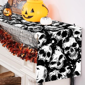 Halloween table runner featuring black and white skull prints for festive party decorations