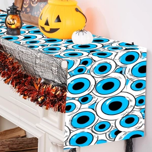 Halloween table runner featuring repeating blue eye patterns for festive party dining decor