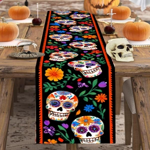 Halloween table runner with sugar skull floral design on a rustic wooden dining table