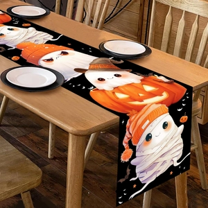 Halloween table runner featuring cute ghost and pumpkin patterns on black fabric background