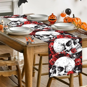 Halloween table runner featuring skull and red roses pattern on a wooden dining table