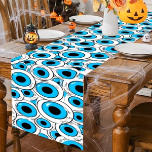 Blue Evil Eye Halloween table runner on wood table with pumpkins and holiday decor