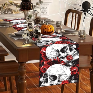 Gothic Halloween table runner with white skull and red rose print on black fabric