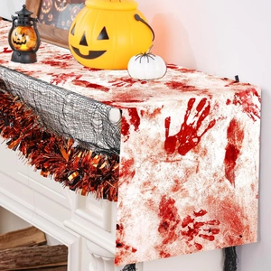 Halloween table runner featuring bloody handprints on a white fabric festive mantle decor