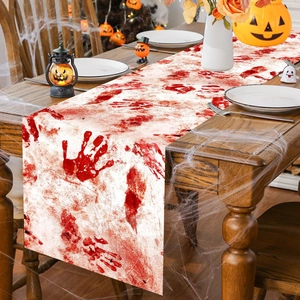Halloween table runner with red bloody handprints for creepy holiday party dining decor