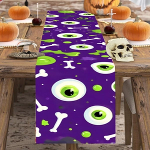Halloween purple table runner featuring green eyeballs and bones for party dining decor