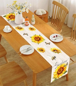Close-up of sunflower and butterfly table runner with wood grain and Sunshine text