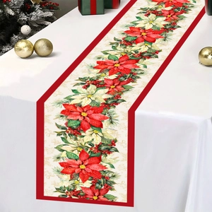 Detail of Christmas poinsettia table runner with red borders and festive floral pattern