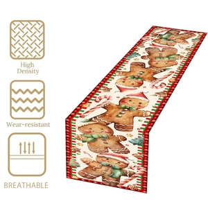 Detail view of high density Christmas table runner with gingerbread man and candy patterns
