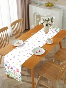 Detail of floral table runner with colorful tulips and lavender on a wooden dining table