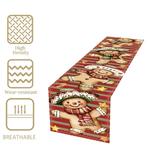 Christmas gingerbread man table runner with festive red and green stripes for party decor